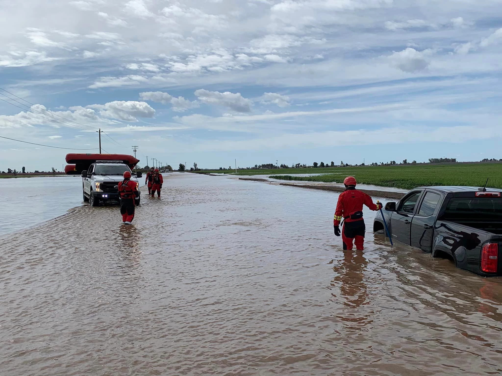 Water Rescue Underway After Man Tries to Drive though Flooded Road