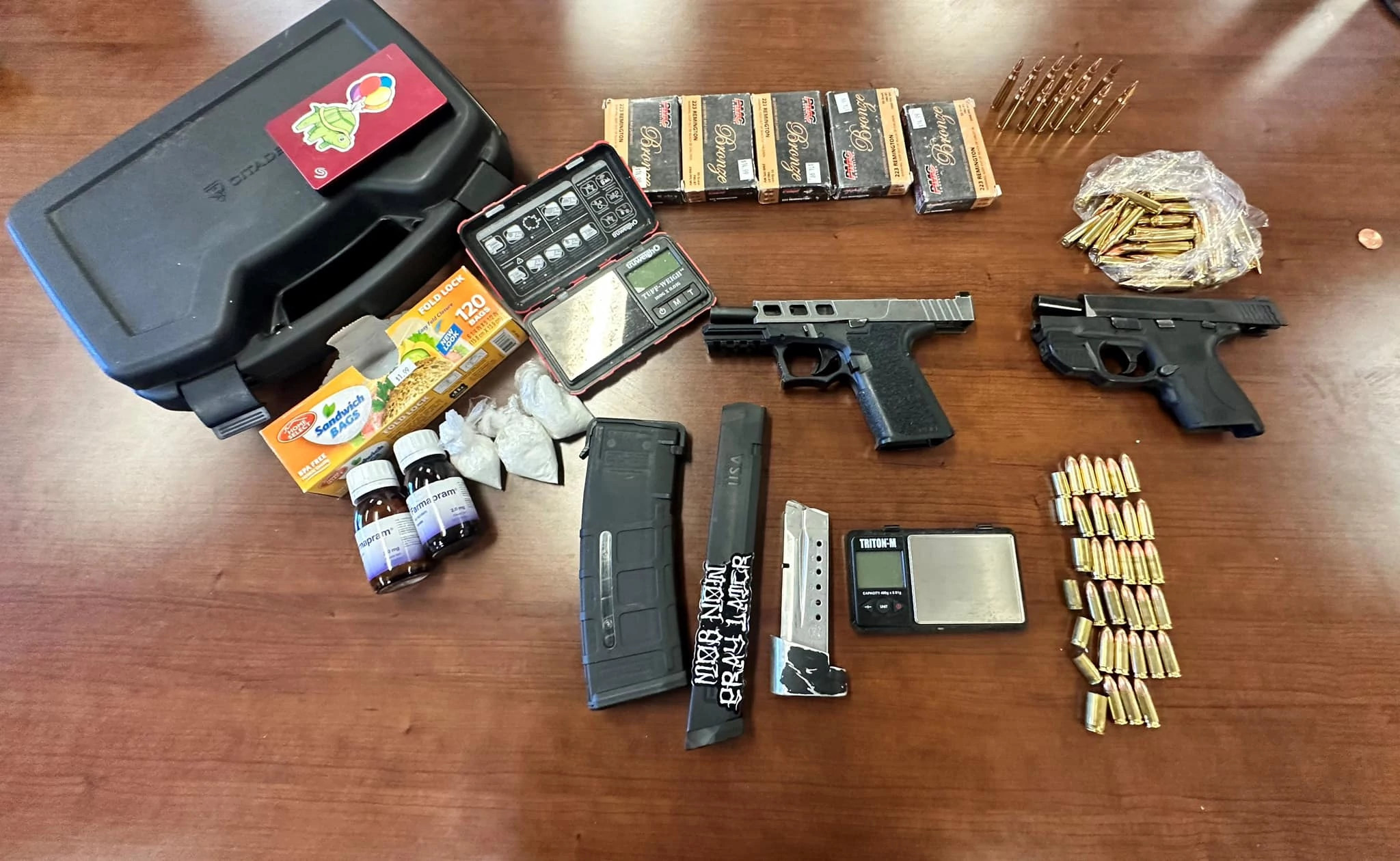 TCSO Deputies Find Backpack Full of Guns & Drugs, Arrest Two